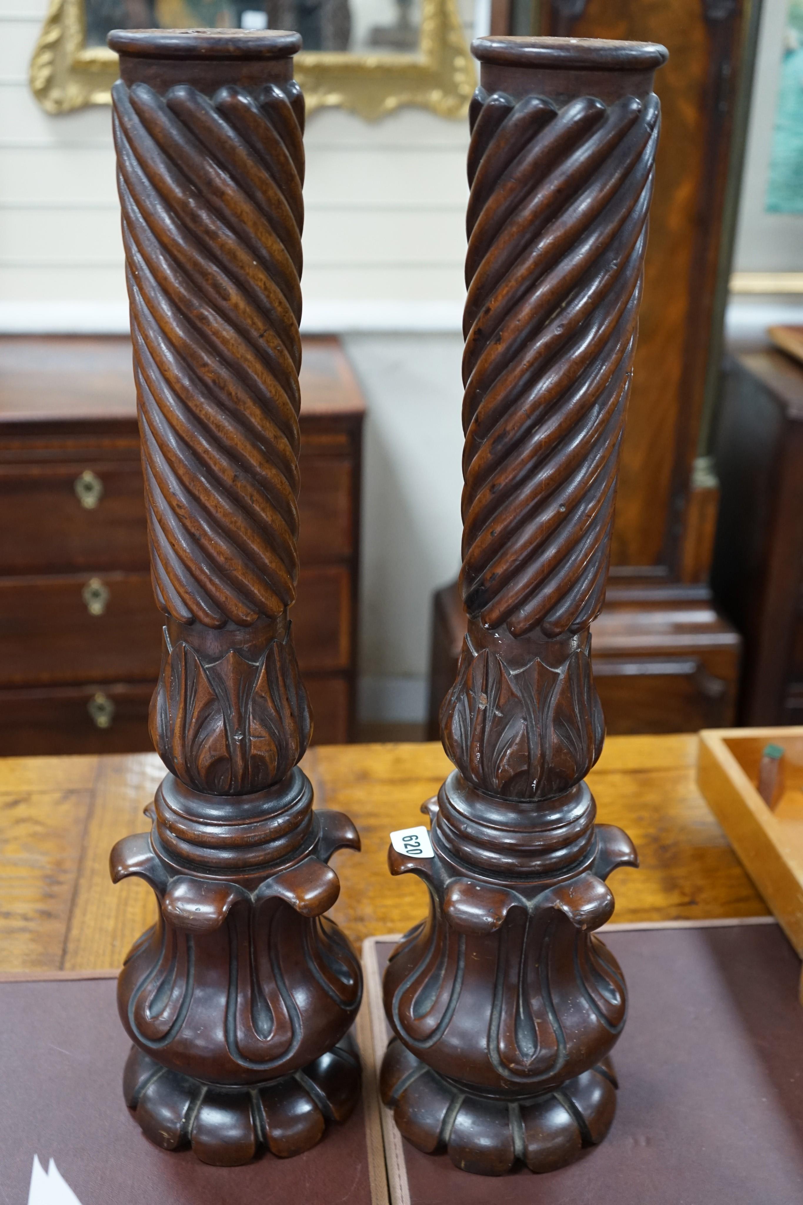 A pair of William mahogany 'bedpost' candlestands